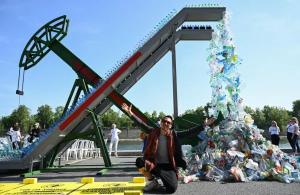 Canadian artist and activist Benjamin Von Wong at the unveiling of his art installation "Perpetual Plastic Machine" on the banks of the Seine River in Paris on May 27, 2023, to support the Global Plastics Treaty (Photo by Bertrand GUAY / AFP) (Photo by BERTRAND GUAY/AFP via Getty Images)